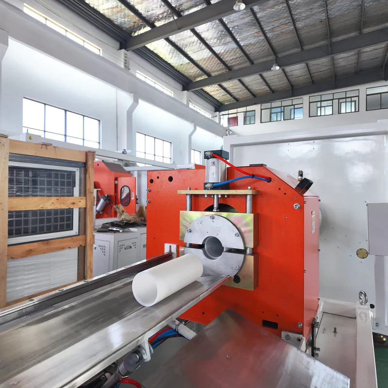 Core tube extrusion line cutting unit in plastic pipe and profile production setup