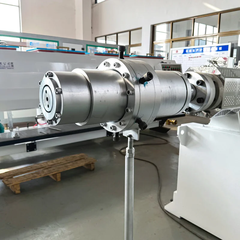 Plastic extrusion machine for manufacturing plastic pipes and profiles in a factory setting
