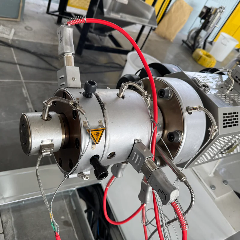 Plastic extrusion machine for pipe and profile production in a showroom scene