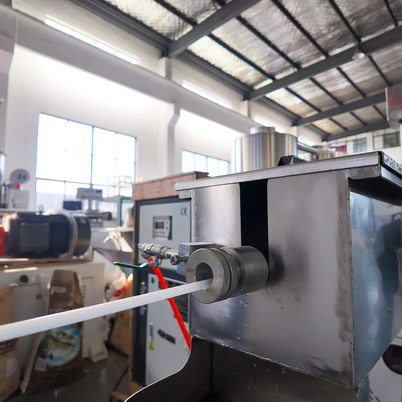 Plastic extrusion machine for manufacturing plastic pipes and profiles in a factory setting