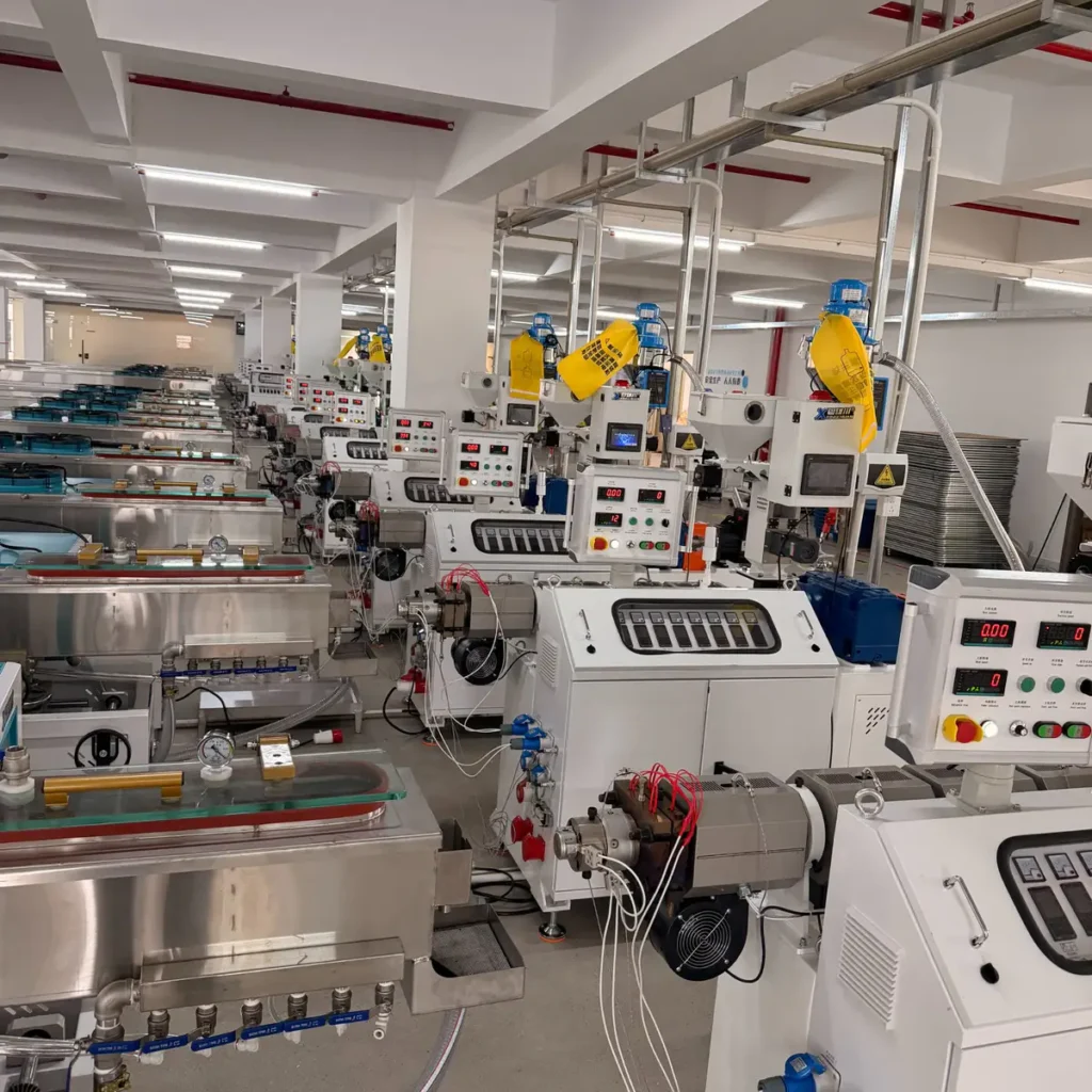 Plastic extrusion machine used for manufacturing plastic pipes and profiles in factory setting