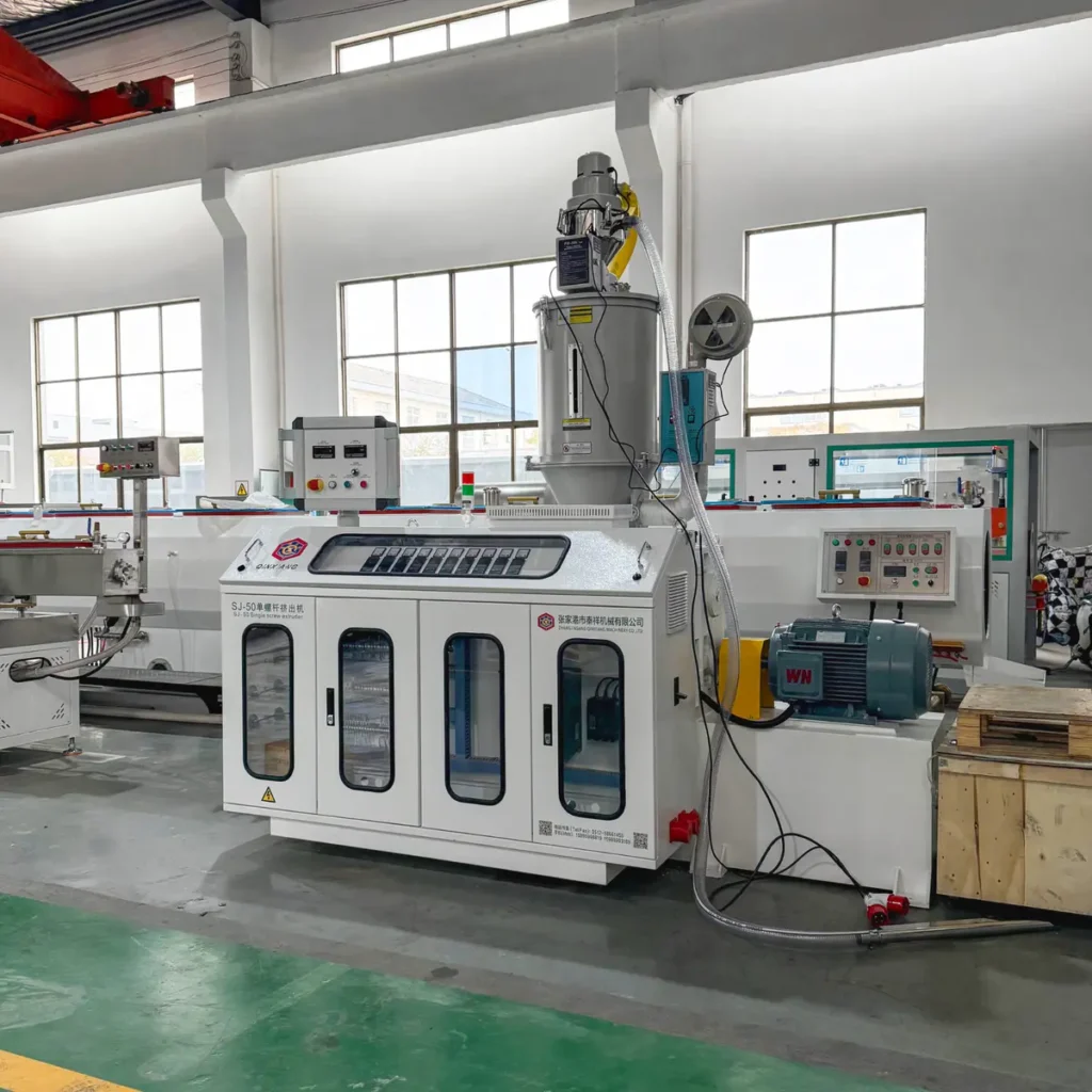 Plastic extrusion machine for plastic pipe and profile production in industrial setting