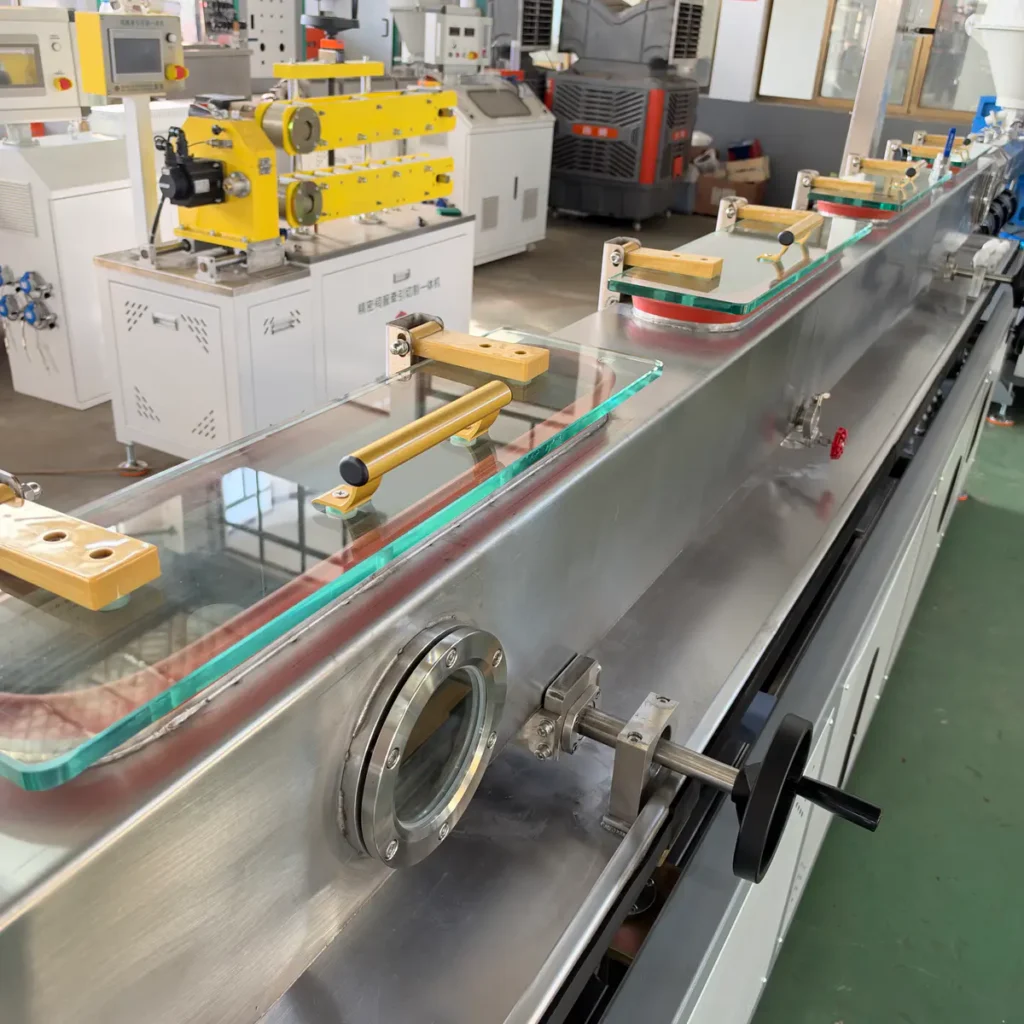 Plastic extrusion machine used for pipe and profile manufacturing in a showroom scene